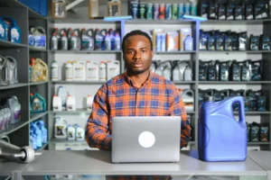 smiling-african-salesman-auto-parts-store